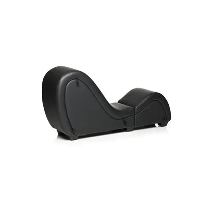 Side profile of the Master Series Kinky Couch black sex chaise lounge showing its curved ergonomic shape and detachable furniture design from angled side view.