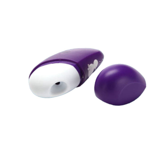 Romp Free compact clitoral stimulator with silicone head and travel cap on white background