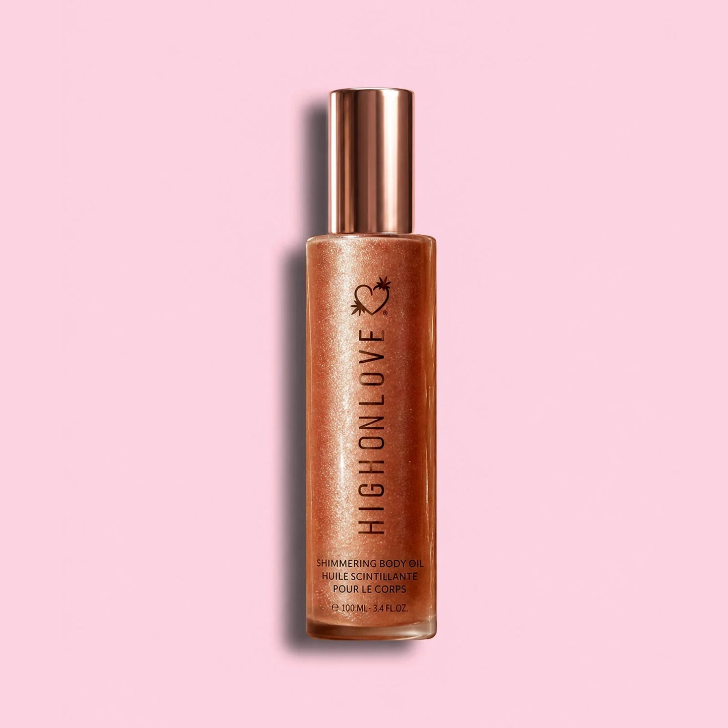 HighOnLove Shimmering Body Oil luxury vegan body glow oil on soft pink background